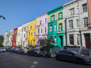A row of British residential houses on a quiet street.